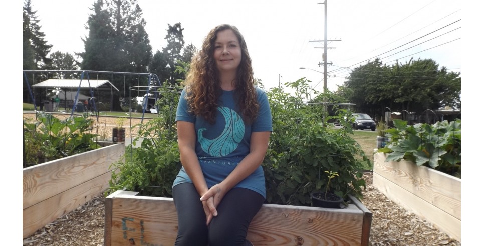 Alena Rogers in the community garden she started – photo credit Barbara Lloyd McMichael 