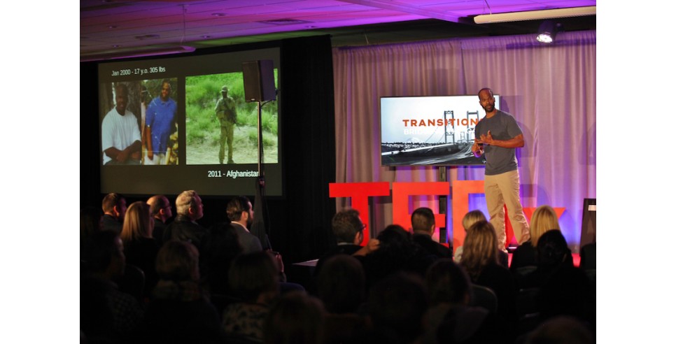 Travis Daigle speaking at a TEDx Tacoma event in 2018